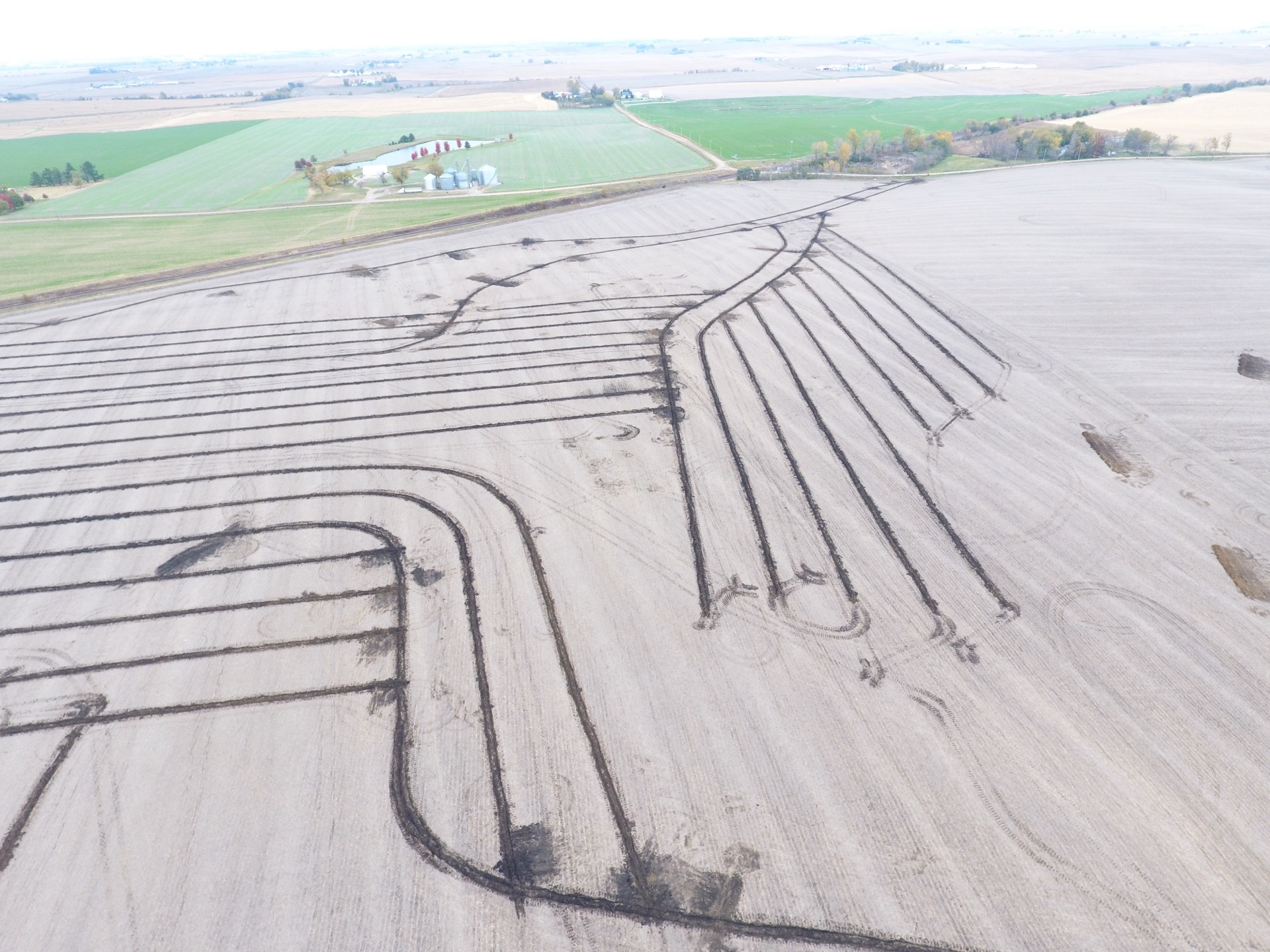 Curved pattern tiling lines installed for field drainage in Iowa Curved pattern tiling lines installed for field drainage in Iowa